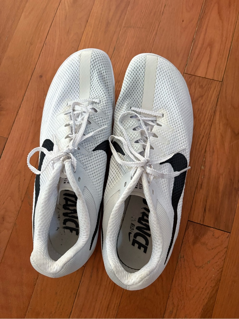 Men's White nike track spikes with tool to add/remove spikes. Worn 2x